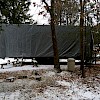 The tiny house, tarped for the Winter